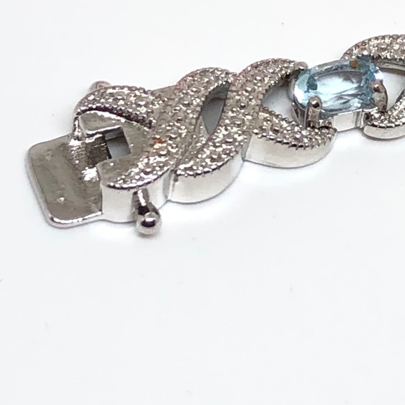 Rhodium Plated Blue Topaz Infinity Bracelet - Picture 8 of 11